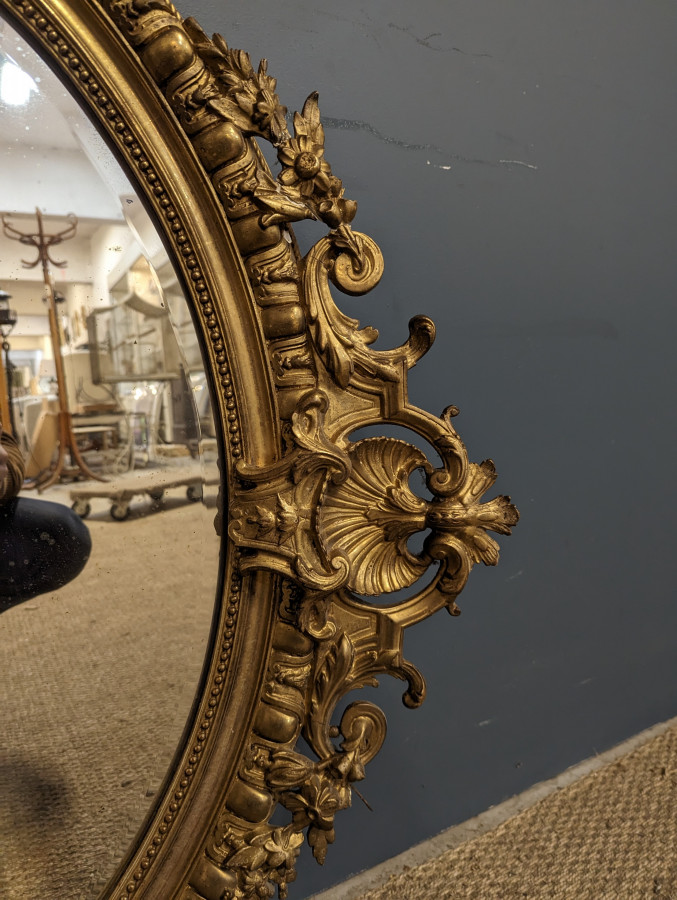 Miroir de style Rocaille Napoléon en bois doré