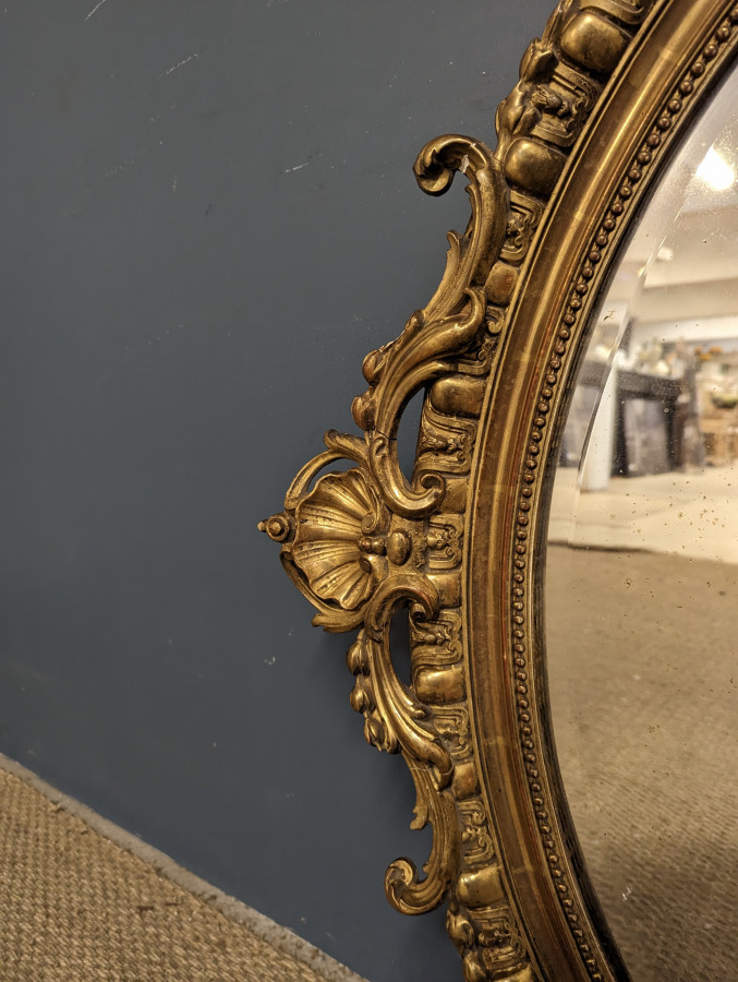 Miroir de style Rocaille Napoléon en bois doré