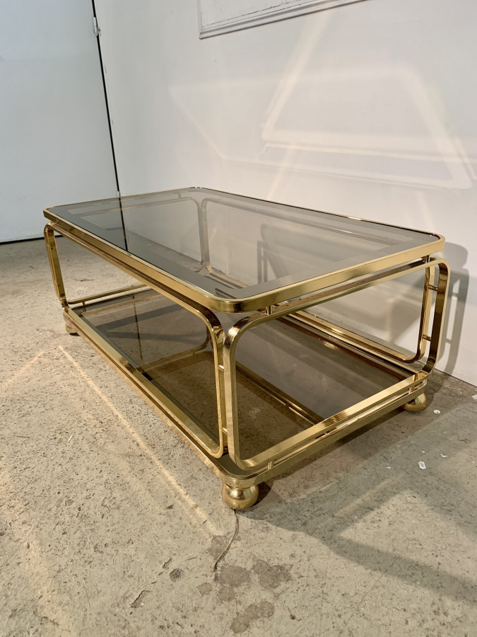 Superbe table basse dorée vitrée